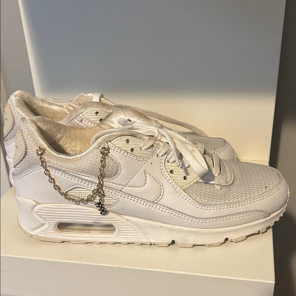 Nike White Sneakers with Gold Chain Accent